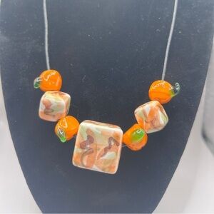 Adorable Fall Glass Bead and pumpkin necklace on black cord